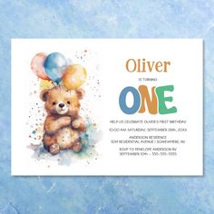 a birthday card with a teddy bear holding balloons and the words,'it's turning one '