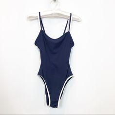 Gorgeous Navy Ribbed One Piece Bathing Suit . Figure Flattering Multi Cup Fit . Slimming Design. White Bra Attached To Suit . Dual Spaghetti Straps . Simple, Clean And Sophisticated Aesthetic. Bust : 16.5” Across In Stretched Excellent Condition. New Without Tags White Bra, Sophisticated Aesthetic, White Bras, One Piece Bathing Suit, Bathing Suit, Womens Swim, Bathing Suits, Spaghetti Strap, Blue White