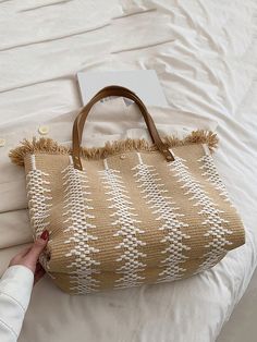 Elevate your beach style with Summer Chic: Fringed Large Capacity Tote Bag. With its spacious design, you can easily carry all your essentials. The fringed details add a touch of effortless style, making it perfect for a day at the beach. Stay in fashion while staying organized. Color : Beige Strap Type : Double Handle Details : Fringe Bag Size : Large Style : Vacation Type : Shoulder Tote Bag Closure Type : Buckle Pattern Type : Colorblock Features : High-capacity Material : Polyester Composition : 100% Polyester Bag Height Bag Length Bag Width 33 43 15 Trendy Beach Shoulder Bag With Tassels, Casual Spring Shoulder Bag With Fringe, Casual White Shoulder Bag With Tassels, Beach Shoulder Bag With Tassels, Rectangular Shape, Trendy Tote Beach Bag With Tassels, Trendy Beach Tote Bag With Tassels, Summer Tote Shoulder Bag With Tassels, Beige Tasseled Beach Bag For Beach Season, Trendy Tassel Beach Tote Bag