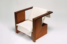 a chair made out of wood and white fabric