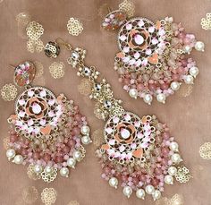 This beautiful earring and maang tikka set is great for any occasion, whether you're attending a wedding, mehendi, sangeet, reception, cultural ceremony or party, this earring and tikka set will definitely be a statement piece for your attire.  This earring and maang tikka set is also a great gift for bridesmaids! This earring and maang tikka set is golden in base, is simulated with kundan, has hand painted work (meenakari), pearls as well as bead drops.  There are 5 different color variations a Indian Wedding Bridesmaids, Diamond Earrings Indian, Jewelry Indian Wedding, Maang Tikka Set, Wedding Mehendi, Sabyasachi Jewelry, Indian Suit, Sabyasachi Jewellery, Pink Emerald