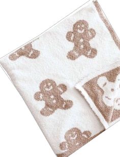 two towels with teddy bears on them and one has a brown bear in the middle