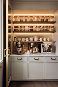 a kitchen with shelves filled with pots and pans