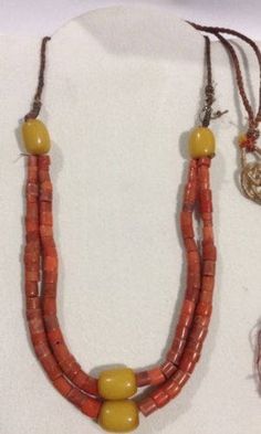 "This is a wonderful strand of Antique CORAL BEADS from Yemen. The upper, shorter strand of coral measures approximately 10 1/4\" (26 cm) long, including the yellow, phenolic plastic beads. The coral is a nice orange and some beads have a hint of brown. Including the string the beads are strung on, it weighs 56.7 grams. This would be great to restring or use in earrings and necklace projects. It is 100% natural, untreated, undyed, genuine coral." Traditional Red Beaded Necklaces For Beach, Traditional Orange Beaded Necklaces For Beach, Traditional Orange Necklace For The Beach, Traditional Orange Jewelry For Beach, Traditional Orange Beach Jewelry, Traditional Fair Trade Beaded Necklaces For Beach, Bohemian Coral Beaded Necklaces, 3d Shape, Vintage Wardrobe