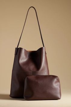 Tall Bucket Bag | Anthropologie On-the-go Tote Satchel With Magnetic Closure, Modern Bucket Box Bag For Errands, Versatile Large Capacity Shoulder Pouch, Modern Rectangular Shopping Pouch, Brown Large Capacity Shoulder Bag Pouch, Brown Large Capacity Shoulder Pouch, Large Capacity Brown Shoulder Bag Pouch, Classic Tote Bag With Magnetic Closure, Elegant Leather Pouch For Errands