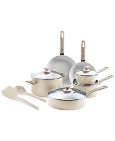 an assortment of pots and pans on a white background