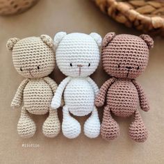 three crocheted teddy bears sitting next to each other