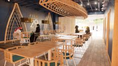 the interior of a restaurant with wooden tables and chairs, people standing in the background