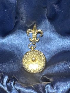 This vintage locket from Coro is a unique find for any jewelry collector. The locket features a beautiful fleur de lis design and can hold two pictures. This piece is signed and dates back to the 1940s. It would make a great addition to any vintage or antique jewelry collection. The locket is in good condition and shows minimal signs of wear. Perfect for gifting or adding to your personal collection. FYI: We have been in pastoral ministry for over 40 years, the goal of selling any items on 'powers-gems' is to support children's ministries in Honduras and other nations where children are being taken from living in the city garbage dumps, educated, feed and clothed by Godly people to give them a future with hope and purpose. Join us:) Vintage Medallion Charms Jewelry, Classic Vintage Charm Locket Necklace Collectible, Vintage Keepsake Charms Jewelry, Vintage Keepsake Jewelry With Charms, Vintage Yellow Gold Locket Necklace For Memorial, Vintage Yellow Gold Memorial Locket Necklace, Vintage Formal Jewelry With Charms, Vintage Jewelry With Antique Finish For Keepsake, Vintage Locket Necklace With Charms As Collectible