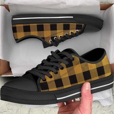 Black and gold buffalo plaid low top sneakers for women with a striking black sole make a definitive fashion statement. These shoes are the look you'll love!      These look great with jeans, shorts, and skirts. These shoes are built to last and look great even after wearing them for awhile. Please double check your order to confirm the size. :) DETAILS Full canvas double sided print  Rounded toe construction Lace-up closure  Metal eyelets  Soft textile lining   Lightweight construction  Maximum Comfortable Black Custom Sneakers With Round Toe, Yellow Low-top Fall Sneakers, Yellow Low-top Sneakers For Fall, Comfortable Black Custom Sneakers, Fall Yellow Low-top Sneakers, Comfortable Black Custom Sneakers For Sneaker Matching, Plaid Sneakers, Blowfish Sneakers, Tie Sneakers