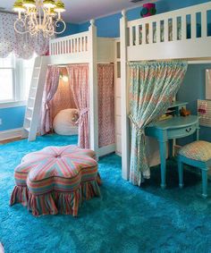 a child's bedroom with bunk beds and blue carpet