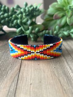 Navajo Made Beaded Bracelet Cuff. It measures 3/4 of an inch wide with an inside circumference of 5 3/4 inches and a gap of 1 1/8 inches. Thank you for checking out my store, if you have any questions please contact me!! Exported By ExportYourStore :) SKU:443852194777_7420* Southwestern Style Bangle Cuff Bracelet For Festivals, Southwestern Multicolor Cuff Bangle, Southwestern Beaded Bangle Bracelets, Southwestern Style Adjustable Cuff Bracelet With Round Beads, Southwestern Style Beaded Bangle Bracelets, Southwestern Cuff Bracelet With Round Beads, Southwestern Style Multicolor Beaded Cuff Bracelet, Southwestern Festival Cuff Bracelet With Round Beads, Southwestern Beaded Bangle Bracelet