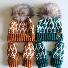 three knitted hats and mittens sitting next to each other