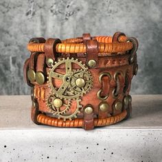 This brown vintage gothic leather bracelet was designed in the steampunk and rock style. The bracelet is made of genuine cow leather and decorated with metal parts. You can either choose one item or a set. Bracelet's width is about 1.97 in (5 cm) Bracelet's length is about 7.9 in (20 cm) It fits the wrist 6.7-7.9 in (17-20 cm) Please measure your wrist to make the correct choice CARE No special care is required. Avoid chemical exposure including perfumery. If you need a custom order please let me know and I will try to do my best to prepare it for you:) If you have any questions feel free to ask.  Thank you for choosing shop Steampunk Leather, Vintage Steampunk, Style Steampunk, Vintage Gothic, Leather Gifts, Rock Style, Cow Leather, Leather Bracelet, Cuff Bracelets