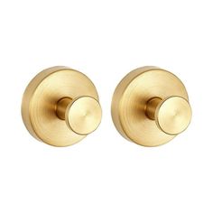 two brass door knobs on white background