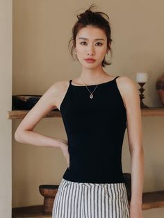 This is a feminine and romantic top by LANGSON that is made out of high quality cotton and polyester blend fabric. With design detail of slim silhouette and minimal detail, it gives a trendy and feminine look.- Slim silhouette- Minimal shoulder strap- Feminine and modern mood Chic Tops With Built-in Bra And Tank Straps, Chic Cotton Camisole With Built-in Bra, Chic Tank Top With Built-in Bra, Chic Sleeveless Top With Built-in Bra, Chic Halter Neck Camisole With Built-in Bra, Elegant Sleeveless Halter Top With Built-in Bra, Elegant Fitted Top With Tank Straps, Chic Solid Sleeveless Blouse Camisole, Chic Solid Sleeveless Camisole