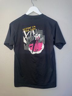 "puttin on  the Ritz 1983 Buddy Austin international Oklahoma City T-shirt Condition: GOOD  measurements: 34\" bust/chest, 27\" length material: cotton/polyester" Fitted Concert T-shirt With Graphic Print, Fitted Pop Culture T-shirt For Streetwear, Fitted Graphic T-shirt For Concerts, Fitted Graphic Print T-shirt For Concert, Retro Fitted Graphic Print T-shirt, Vintage Fitted T-shirt For Streetwear, Fitted Vintage T-shirt For Streetwear, 90s Style Concert T-shirt With Screen Print, Fitted Screen Print T-shirt For Concerts