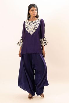 Purple kurta with floral embroidered yoke and cuffs. Paired with a japanese pant.
Components: 2
Pattern: Embroidery
Type Of Work: Floral
Neckline: Round Neck
Sleeve Type: Full Sleeves
Fabric: Kurta: Chanderi, Pant: Modal Satin, Lining: Mul Cotton
Color: Purple
Other Details: 
Attached inner lining
Closure: Elastic
Occasion: Sangeet - Aza Fashions Bollywood Palazzo Set With Straight Kurta And Floral Embroidery, Bollywood Style Palazzo Set With Floral Embroidery, Eid Floral Embroidered Art Silk Palazzo Set, Eid Floral Embroidery Art Silk Palazzo Set, Purple Floral Embroidery Sets For Eid, Designer Wear Sets With Floral Embroidery In Traditional Drape, Embroidered Mulmul Palazzo Set For Navratri, Designer Wear Floral Embroidery Palazzo Set In Raw Silk, Art Silk Palazzo Set With Chikankari Embroidery For Navratri