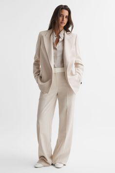 Embrace a modern suiting agenda with the Maya blazer in neutral. It’s tailored into a sleek, single-breasted shape with peak lapels. Contrary to a traditional workwear silhouette, it doesn’t fasten at the front, resulting in a more laidback look. Streamline your edit by pairing with the coordinating trousers and choosing tonal heels. Single breasted Peak lapels Long sleeves Jetted pockets Tailored fit Lined Ivory Suit Women, Mum Wedding, Property Consultant, Single Breasted Suit, Open Blazer, Bride Outfits, Suit Jackets For Women, Loungewear Shorts, Luxury Property