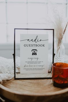 the guest book is next to a glass