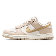 The Nike Dunk Low “Phantom Metallic Gold” is a luxurious and eye-catching rendition of the iconic silhouette, offering a blend of subtlety and opulence. This sneaker features a sophisticated ‘Phantom’ base color, a muted off-white that provides a perfect canvas for the striking ‘Metallic Gold’ accents. These gold highlights adorn the swoosh, heel tab, and [...] Dunk Nike, Tenis Nike, Gold Sneakers, Nike Gold, Dunks Nike, Gold Highlights, Nike Dunk Low, Dunk Low, Nike Dunk