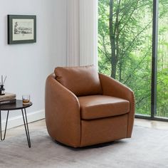 a living room with a brown chair and table