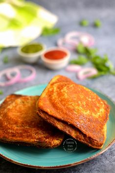 two pieces of toast on a plate with dipping sauces in the backgroud