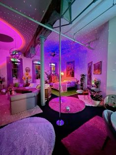 the room is decorated in pink, purple and white colors with round rugs on the floor