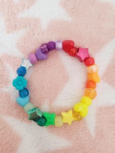 Cute rainbow bracelet with random beads Rainbow Kandi, Bracelets Kandi, Kandi Bracelets, Cute Rainbow, Rainbow Bracelet, Arm Band, Halloween Shopping, Jewelry Bracelets, Accessory Gift