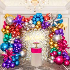 a room decorated with balloons and streamers