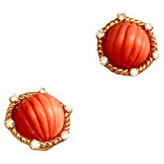 Simple but extremely elegant earrings. Main stone is carved fluted Sciacca Mediterranean coral of a warm lush orange tonality. Very well carved, of even color throughout and well matched. The gems are set within a rope twisted 18kt gold halo. This border with six nicely sized brilliant fiery white diamonds. This is some of the prettiest coral I’ve had in a while. The earrings are secured with a clip back. Judging from the style and quality of the material I think these beautiful pair date from s Elegant Orange Clip-on Earrings, Elegant Carved Orange Jewelry, Elegant Orange Carved Jewelry, Rope Twist, Mabe Pearl, Gold Clips, Coral And Gold, Gold Halo, Green Enamel