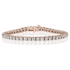 A classic tennis bracelet style showcasing a row of round brilliant diamonds, set in a polished 14k rose gold mounting. Diamonds weigh 4.01 carats total and are approximately GH color, SI1 clarity. Style is available in different price ranges. Prices are based on your selection of the 4C’s (Carat, Color, Clarity, Cut). Don't hesitate to get in touch with us for more information.