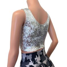 The perfect crop tank top for your rave or festival outfit. This top is made of 4-way stretch white with silver gilded metallic velvet. Top fit snug to the body and sits above the belly button. Metallic Cropped Disco Crop Top, Fitted Metallic Shiny Crop Top, Metallic Shiny Fitted Crop Top, Metallic Fitted Disco Crop Top, Silver Sleeveless Tank Top For Club, Metallic Fitted Tank Top, Glamorous Stretch Crop Top For Party Season, Fitted Metallic Glamorous Crop Top, Fitted Cropped Crop Top For Party Season