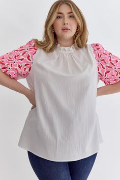 Solid mock neck puff sleeve top featuring ruffled neckline. Contrasting sleeves. Unlined. Woven. Non-sheer. Lightweight.Fabric Content: 98%POLYESTER 2%SPANDEX Measurements:Bust: small40", medium 42", large 44", X-large 50", 1X 52", 2X 54"Length: small 25", medium 26", large 27", X-large 28", 1X 29", 2X 30" Spring Short Sleeve Puff Top With Pleated Sleeves, Stretch Puff Sleeve Blouse With Ruffles, Spring Puff Sleeve Top With Pleated Sleeves, Feminine Short Sleeve Tops With Pleated Sleeves, Spring Crew Neck Puff Sleeve Top With Gathered Sleeves, Summer Tops With Ruffle Elastic Sleeves, Spring Workwear Blouse With Elastic Shoulders, Summer Ruffle Sleeve Top With Elastic Sleeves, Spring Blouse For Workwear With Elastic Shoulders