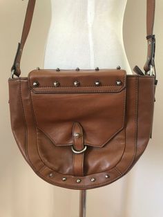 Kooba Jules Leather Crossbody Bag Handbag Purse in 230 Earth Brown Med $328 NWT. Featuring an adjustable crossbody strap with magnetic top closure and zipper. It has an exterior slip pocket perfect for your phone or sunglasses and an interior zipper pocket. SUPER SOFT LEATHER, it is lightweight and very roomy inside. Measures: Length 9"; Width 11"; Depth 3"; Strap Length 21" adjusts to 23". Retail $328.00. https://www.ebay.com/str/fabulousfindsshop Y2k Bags, Vintage Y2k, Handbag Purse, Crossbody Strap, Leather Crossbody Bag, Leather Crossbody, Soft Leather, Zipper Pocket, Messenger Bag