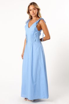 DETAILS  Experience a blend of comfort and style with our Lainey Maxi Dress in Blue. This outfit is defined by its maxi length and a flattering V neckline, complemented by wide straps that close with a double tie for an added touch of elegance. The back mirrors the front with a V design, and the bodice features pleat details for that extra sophistication.  maxi length  v neckline  wide straps with double tie close  back v design  pleat detail on bodice  side invisible zip with hook and eye clasp Summer V-neck Maxi Dress With Tie Fastening, V-neck Midi Dress With Tie Straps For Vacation, V-neck Maxi Dress With Tie Straps For Day Out, Elegant Summer Maxi Dress With Tie Fastening, Blue V-neck Maxi Dress With Tie Back, Brunch V-neck Maxi Dress With Tie Back, V-neck Maxi Dress With Tie Back For Brunch, Blue Beach Dress With Knotted Straps, Solid Maxi Dresses With Tie Back