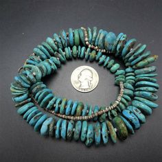 ". VINTAGE NAVAJO TURQUOISE NECKLACE DESCRIPTION: This strand features hand rolled graduated disc beads of Morenci turquoise, spaced and finished with fine hand rolled shell heishi. This gorgeous necklace will be a valuable addition to your collection of fine vintage Native American jewelry. MEASUREMENTS: Necklace measures 30\" end to end Beads measure from 9mm to 22mm across Beads are securely strung on natural fiber WEIGHT: 116.0 grams SIGNED: no" Vintage Beaded Turquoise Necklace With Round Beads, Adjustable Vintage Turquoise Necklace With Round Beads, Vintage Turquoise Necklace With Round Gemstone Beads, Vintage Turquoise Necklace Hand-strung, Vintage Turquoise Single Strand Beaded Necklace, Vintage Turquoise Beaded Necklaces With Round Beads, Vintage Hand-strung Turquoise Necklace, Vintage Turquoise Beaded Necklace With Large Beads, Vintage Turquoise Beaded Necklace With Gemstone Beads