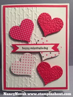 a valentine's day card with hearts and ribbon on the front, which reads happy valentine's day