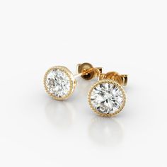 18K Yellow Gold Milgrain Bezel Diamond Stud Earrings (Mounting). This design is the perfect mix of modern and vintage design, crafted to accent the beauty of the round brilliant diamond of your choice with a milgrain bezel and rolled wire basket. This earring will fit slightly off the ear and features friction backs. Bezel Diamond Earrings, Luxury Yellow Gold Diamond Earrings With Single Cut Diamonds, Luxury Yellow Gold Diamond Earrings With Single Cut, Luxury Yellow Gold Diamond Earrings For Anniversary, Luxury Diamond Earrings With Halo Design, Luxury Round Diamond White Earrings, Luxury Earrings With Single Cut Diamonds And Cubic Zirconia, Luxury Cubic Zirconia Earrings With Single Cut Diamonds, Luxury Diamond Halo Earrings For Anniversary