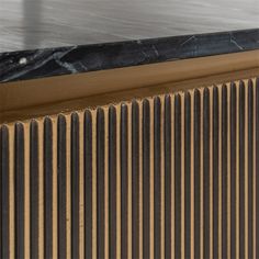 a close up view of a radiator in a room with wood and marble