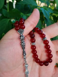 ✔️ This magnificent tasbih made with AA quality 8 mm carnelian agate beads. ✔️ It is a elegant and striking tesbih. ✔️ Natural Color ✔️ Natural Stone ✔️ Each order comes in a special box. ✔️ PLEASE CLICK THE LINK FOR ALL PRAYER BEADS MODELS https://www.etsy.com/shop/GoodJewelsofYazmasal Note: As a natural feature the stones beads may have some variations. SHIPPING: United States (Standart/DHL eCommerce/usps): 7-10 business days United States (Express/FedEx): 3-5 business days Canada (Express/Fed Red Gemstone Beads As Gift, Traditional Carnelian Beads As A Gift, Red Spiritual Beads As Gift, Red Spiritual Beads And Cabochons For Jewelry Making, Red Carnelian Beads For Gift, Round Beads Rosary With Natural Stones For Gift, Bohemian Red Beads And Gems For Gifts, Red Gemstone Beads For Gifts, Red Carnelian Beads For Gifts