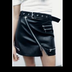 High-Waist Mini Skirt With A Belt In The Same Fabric With Metal Buckle, Zip Appliqus. Edgy High-waist Skirt With Belt Loops, Black Skirt With Belt Detail For Work, Black Workwear Skirt With Belt Detail, Fall High-waist Mini Skirt With Belt, Fall High Waist Mini Skirt With Belt, Trendy Fitted Skirt With Belt Detail, Edgy High-waist Mini Skirt With Belt Loops, Edgy High Waist Mini Skirt With Belt Loops, Casual Black Mini Skirt With Belt