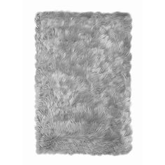 a gray furry rug is shown on a white background, with the area for text to be added