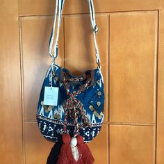 Nwt Boho Tribal Beach Bag With Adjustable Strap Accented With Colorful Tassels And Gold Coins Beach Hobo Bag With Adjustable Strap, Casual Pouch Hobo Bag For Vacation, Bohemian Beach Bucket Bag In Pouch Shape, Bohemian Pouch Bucket Bag For The Beach, Bohemian Beach Bucket Bag Pouch, Vacation Tote Hobo Bag With Adjustable Strap, Hobo Tote Bag With Adjustable Strap For Vacation, Vacation Hobo Tote Bag With Adjustable Strap, Casual Vacation Crossbody Bucket Bag