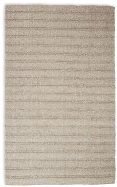 a beige rug with vertical stripes on it