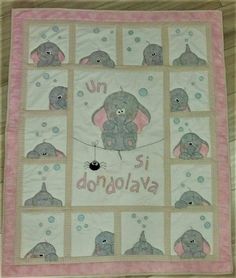 a baby quilt with elephants on it and the words donjojava written in cursive