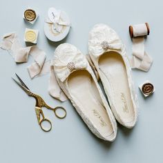 Flat lace slip on wedding shoes. Handmade lace bridal flats. Made from soft ivory lace, finished with a delicate bow and diamante embellishment.  100% leather insoles for comfort Soft lace & Diamonte Detail Handmade keepsake box 0.5cm flat heel Available in Ivory Available in sizes UK 2 - 8; EU 35 - 41 Fits true to size - order your usual size - if in between sizes size up Enveloped in the signature House of Elliot ivory lace, the dainty 'Evie Elliot' lace bridal ballet flats are a delightful al Vintage Wedding Boots, Lace Wedding Boots, House Of Elliot, Ivory Ballet Flats, Bridal Ballet Flats, Wedding Ballet Flats, Ivory Flats, Shoes For Bride, Bridal Shoes Low Heel