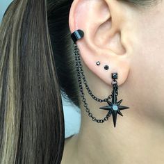 Eye catching and edgy Starburst earrings and cuff  are made of 316L Stainless steel .  Can be purchased as single or a pair. Star earrings -1 1/4 inches long Cuff is 6mm wide Short chain 1 3/4 inches MATCHING STUD IS AVAILABLE HERE: https://www.etsy.com/listing/1505099493/north-star-earring-starburst-earrings?click_key=7109df00438434e9749a84d627c791cbb97fe926%3A1505099493&click_sum=1ba011e1&ga_search_query=star&ref=shop_items_search_2&pro=1&sts=1 Different Star Designs, Goth Ear Piercings Grunge Jewelry, Ear Piercings Gothic, Black Star Earrings, Gothic Ear Piercings, Alternative Ear Piercings, Black Dangle Metal Piercings, Black Metal Dangle Piercings, Black Star-shaped Earrings For Party