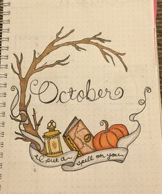 an open notebook with the words october written in cursive writing and pumpkins