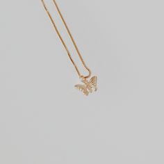 This butterfly necklace will add a delicate touch to any look with its chain and pendant. Treat yourself or a loved one to a unique piece of jewelry today! ∙ D E T A I LS ∙- 18k Gold Filled- 18 inches in length- Box Chain - Hypoallergenic (lead + nickel free) ∙ G O L D ∙ F I L L E D ∙ Gold-filled components contain 100+ times more real gold than gold-plated components and are both durable and tarnish resistant. It is more affordable and accessible than solid gold but higher quality than gold plated. Dainty Butterfly Charm Pendant Necklace, Dainty Pendant Necklace With Butterfly Charm, Dainty Gold-plated Jewelry With Butterfly Charm, Dainty Gold Plated Jewelry With Butterfly Charm, Dainty Gold Butterfly Jewelry, Dainty Butterfly Pendant Necklace With Clavicle Chain, Gold Dainty Butterfly Pendant Necklace, Dainty Butterfly Pendant Necklace With Delicate Chain, Dainty Butterfly Charm Jewelry For Mother's Day